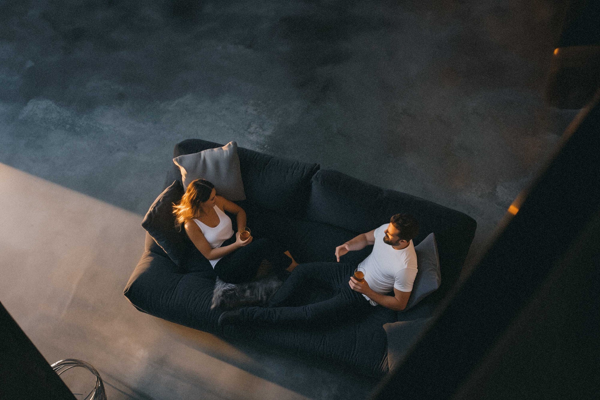 Driftology couple drinking non-alcoholic nightcap on couch