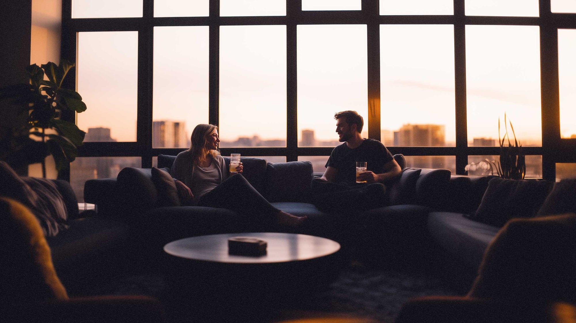 Driftology couple having non-alcoholic mocktail and nightcap on couch